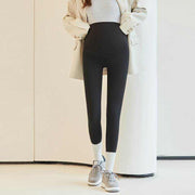 Fleece-lined maternity pants with stretchy waistband for comfort and style.