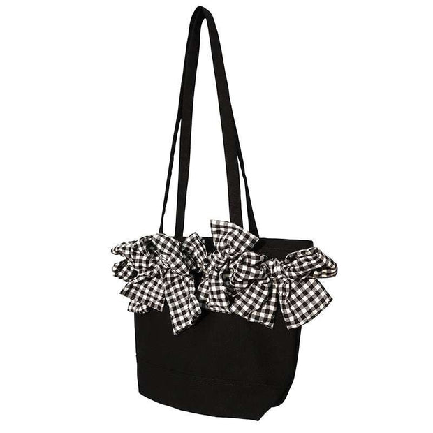 Big Bow Crossbody Bag with oversized checkered bow, black nylon material, and adjustable strap.
