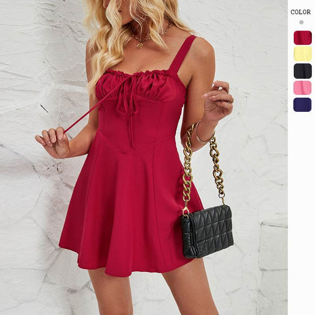 Sleeveless solid color A-line dress in red.