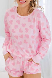Pink heart print loungewear set with matching top and shorts for comfort and style.