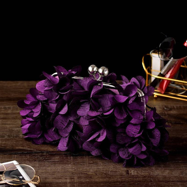Elegant bridal clutch with luxurious floral design in deep purple, perfect for weddings.