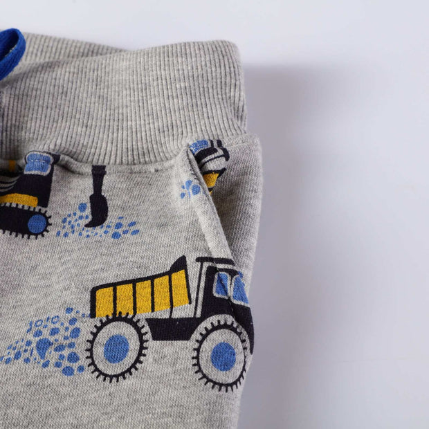 Boys Spring And Autumn Pants with tractor pattern and ribbed waistband.