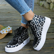 Leather Leopard Platform Sneakers with bold leopard print, premium leather, and cushioned platform sole for style and comfort.
