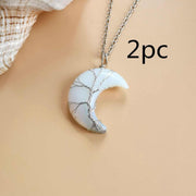 Moon Tree of Life Necklace with white crystal crescent pendant and silver chain.