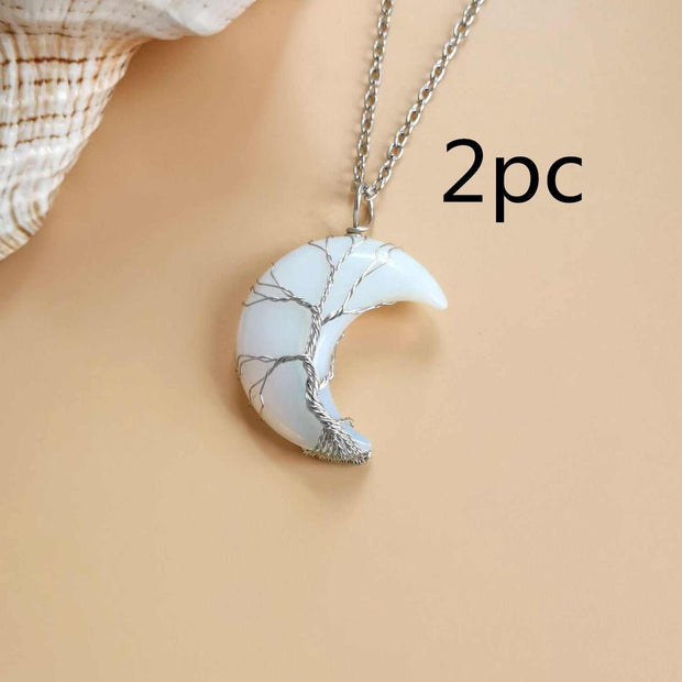 Moon Tree of Life Necklace with white crystal crescent pendant and silver chain.
