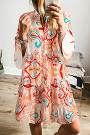 White Boho Print Mini Dress with vibrant ethnic print, ruffled hem, and relaxed fit.
