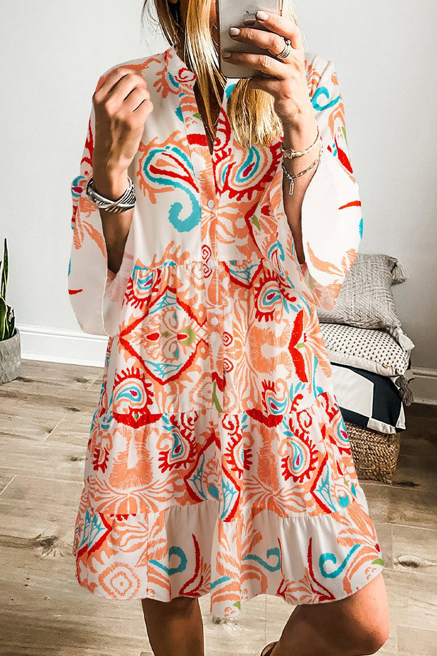 White Boho Print Mini Dress with vibrant ethnic print, ruffled hem, and relaxed fit.