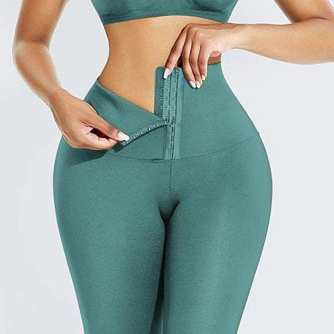 Abdominal Hip Lift Yoga Pants with high-waisted compression feature in bean green color.
