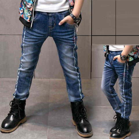 Boys denim jeans with adjustable waistband and reinforced stitching for durability.