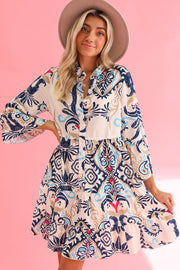 White Boho Print Mini Dress with whimsical design and playful mini length.