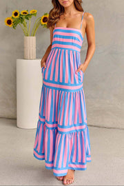 Blue and pink striped smocked dress against beige background with sunflowers.