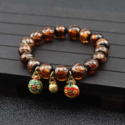 Gray colored glaze bracelet with smooth glossy finish and geometric design.