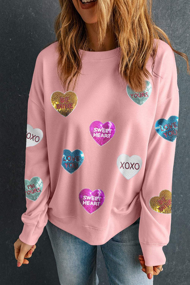 Pink Graphic Valentines Sweatshirt with sequin heart graphics and romantic letters, perfect for a casual, playful look.