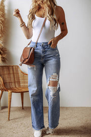 Distressed Straight Leg Jeans with ripped detailing in sky blue denim.