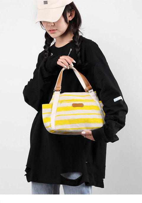 One-Shoulder Tote in yellow stripes, stylish and spacious for everyday use.