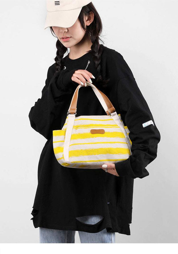 One-Shoulder Tote in yellow stripes, stylish and spacious for everyday use.