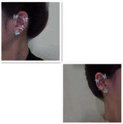 Butterfly ear clip and hook earrings on ear, silver color, elegant design.