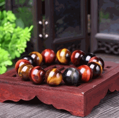 Tiger Eye Bracelet with natural stones, polished beads, and elastic design.