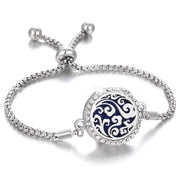 Hollow Stainless Steel Aromatherapy Bracelet with adjustable band and ornate design.