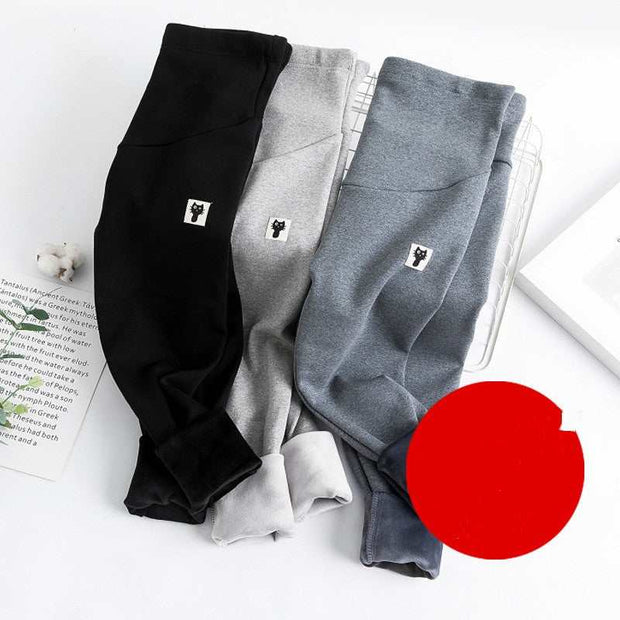 Fleece-lined maternity leggings in black, gray, and light gray shades on display.