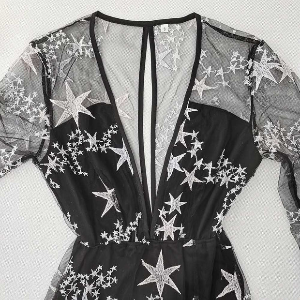 Elegant black lace dress with star patterns, V-neck, and high waist design.