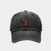 Black vintage baseball cap with red embroidery on the front, featuring a washed-out retro style and adjustable strap.