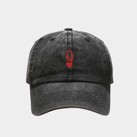 Black vintage baseball cap with red embroidery on the front, featuring a washed-out retro style and adjustable strap.