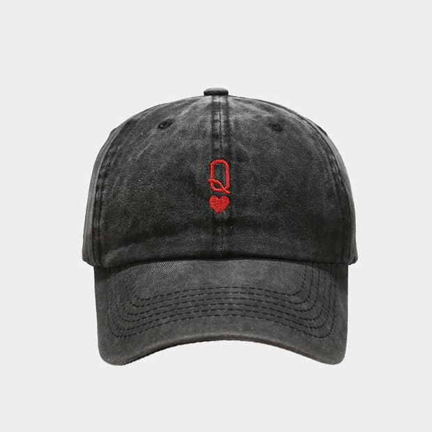 Black vintage baseball cap with red embroidery on the front, featuring a washed-out retro style and adjustable strap.