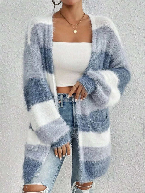 Open Front Striped Knit Cardigan in white and grey with pockets, worn over a white crop top and ripped jeans