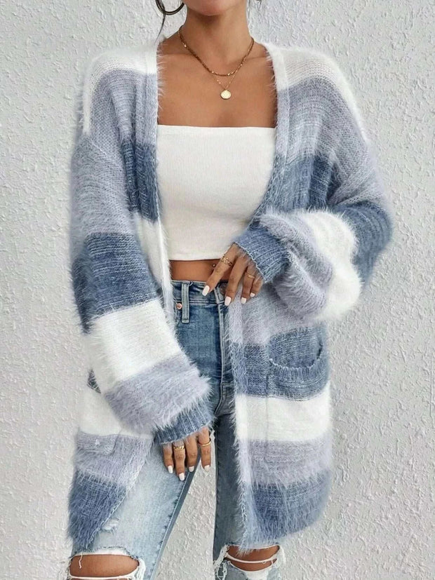 Open Front Striped Knit Cardigan in white and grey with pockets, worn over a white crop top and ripped jeans