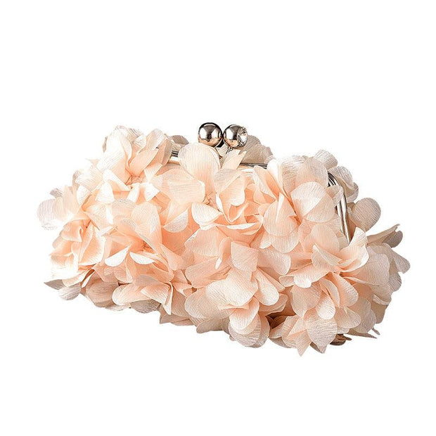 Elegant bridal clutch with floral embellishments and silver clasp.