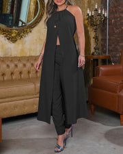 Stylish black sleeveless backless halter suit in an elegant indoor setting.