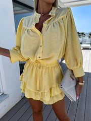 Yellow cotton linen shirt outfit with button-down design, relaxed fit, and ruffled skirt, ideal for casual or polished occasions.
