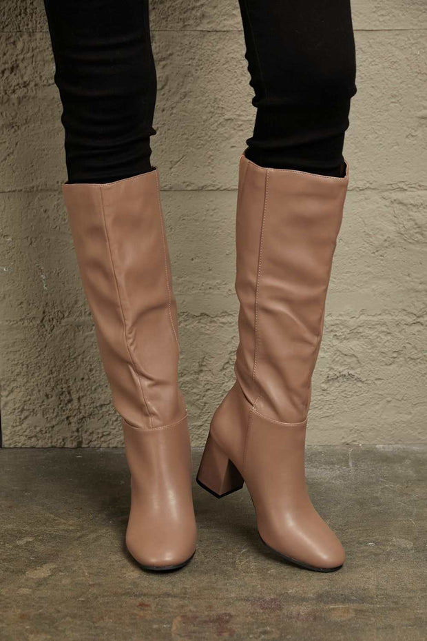 East Lion Knee High Boots in beige with block heel and side zipper.