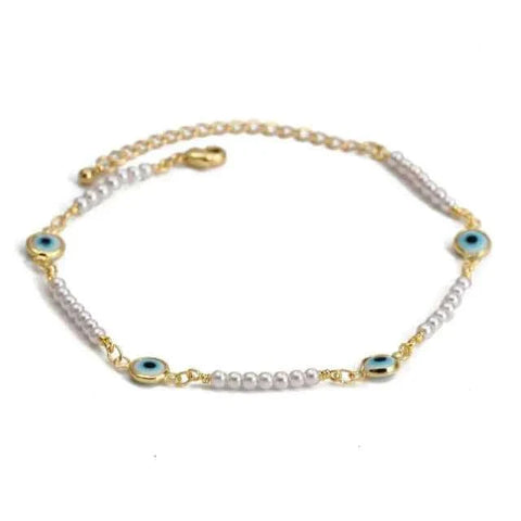 Delicate charm bracelet with blue eye motifs and pearl beads, featuring a secure clasp, ideal for self-expression and personal storytelling.