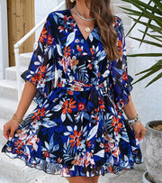 Vibrant Floral Print Short Sleeve Dress with Belted Waist and Flowy Skirt.