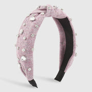 Heart Diamond Headband with sparkling diamonds on purple cloth, elegant women's accessory.