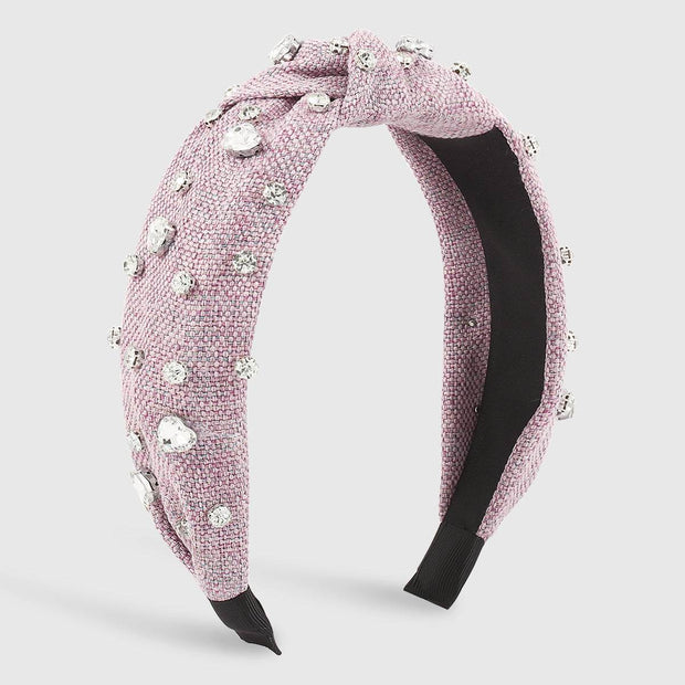 Heart Diamond Headband with sparkling diamonds on purple cloth, elegant women's accessory.