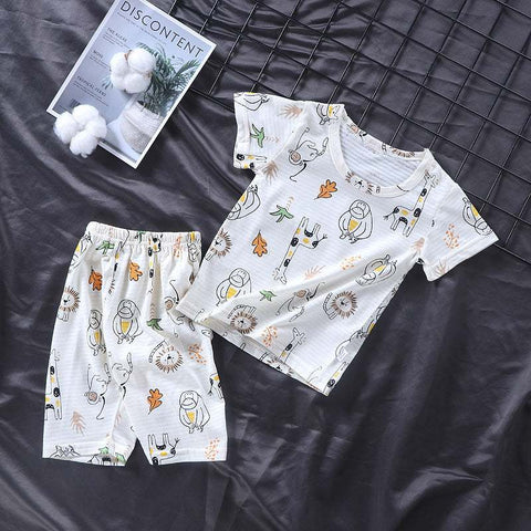 Youth Pajama Set featuring playful patterns on soft, breathable fabric with a short-sleeve top and matching shorts.