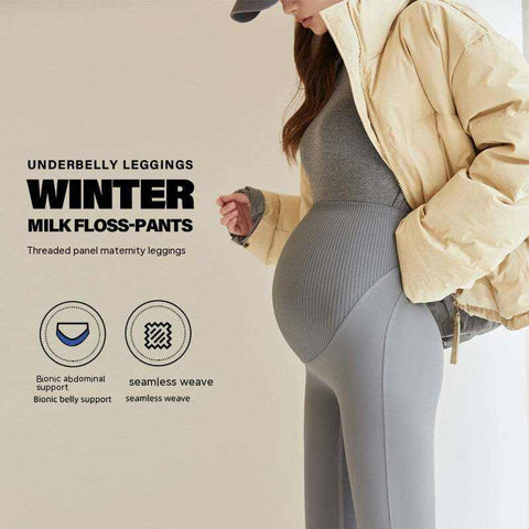 Fleece-lined maternity pants in gray with a stretchy waistband for abdominal support, suitable for winter wear.