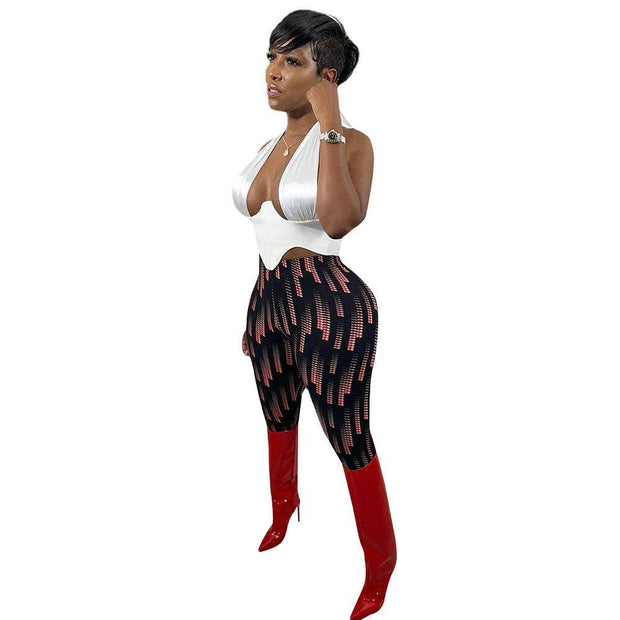Casual silk print leggings with unique design and luxurious feel, paired with a stylish top and boots.