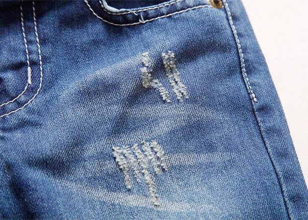 European style boys' ripped jeans with distressed detailing.
