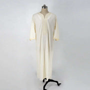 Embroidery White Muslim Robe with intricate embroidery, showcasing elegant and modest style on mannequin.