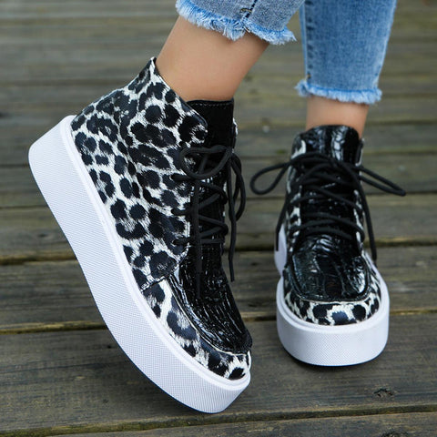 Leather Leopard Platform Sneakers with chic leopard print and white platform sole.