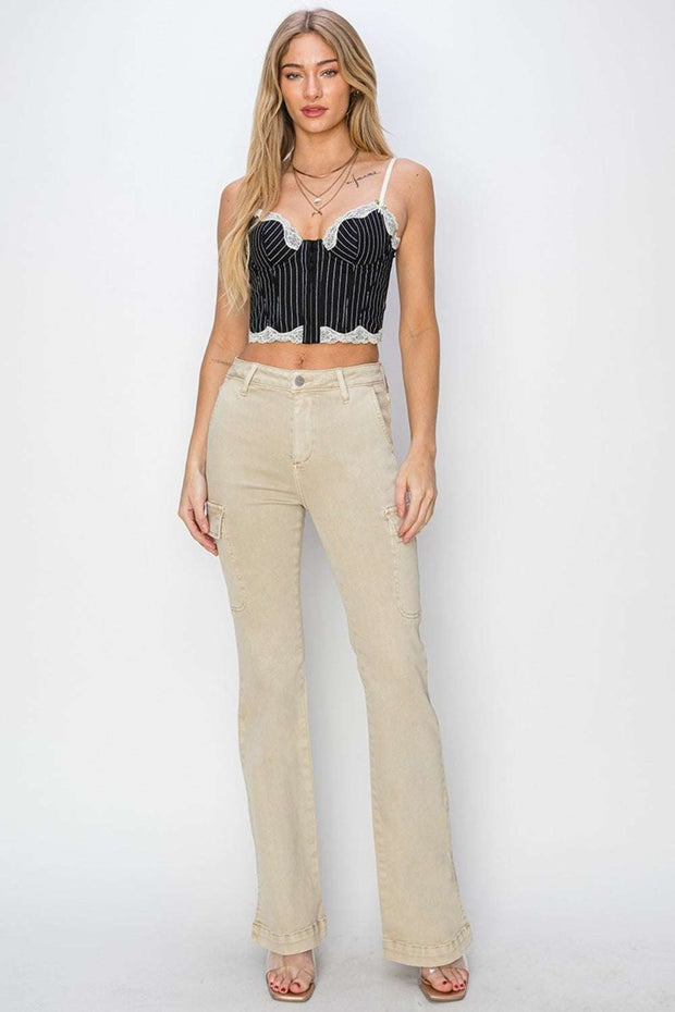Woman wearing RISEN High Rise Boot-cut Jeans with a striped crop top.