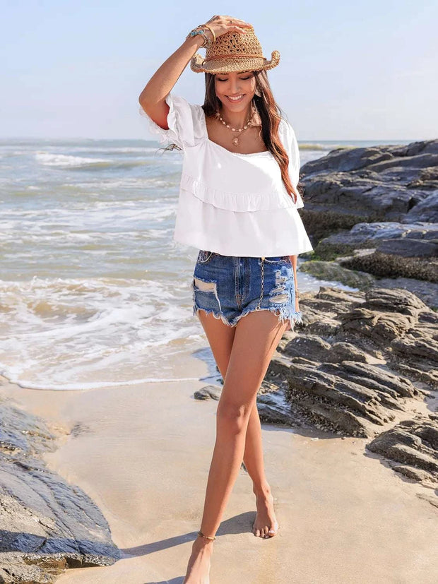 Ruffled square neck half sleeve blouse on woman at beach.