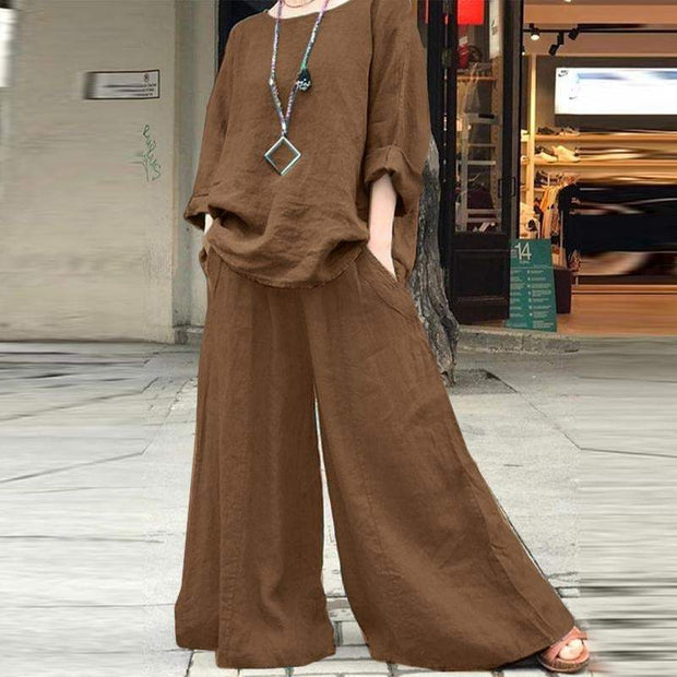 Solid color linen pants and shirt set in brown, featuring a relaxed fit with pockets, ideal for comfortable everyday wear.