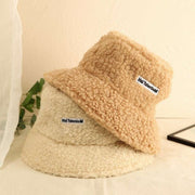 Lambswool Female Fishing Cap in beige and cream colors, stylish and cozy for outdoor activities.
