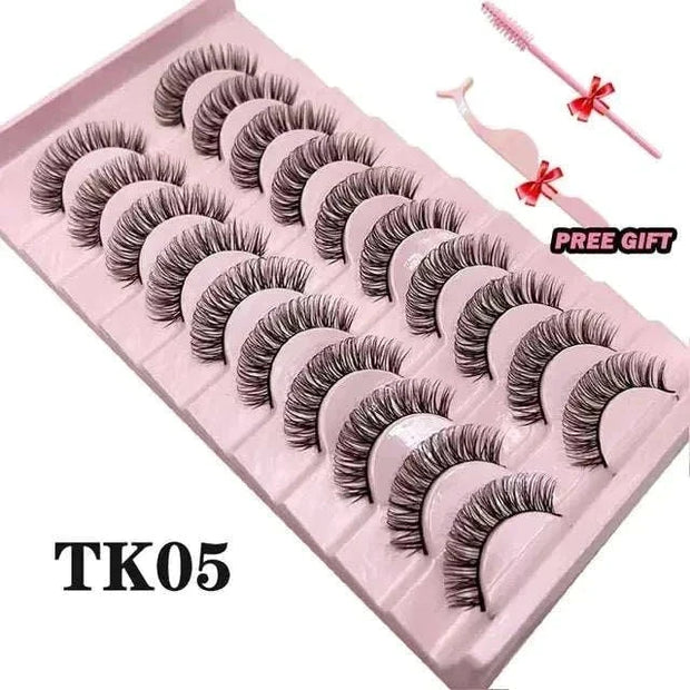 Fluffy Mink Lashes in pink packaging with free applicator and brush.