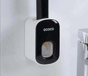 Automatic Toothpaste Dispenser wall-mounted design in a bathroom.